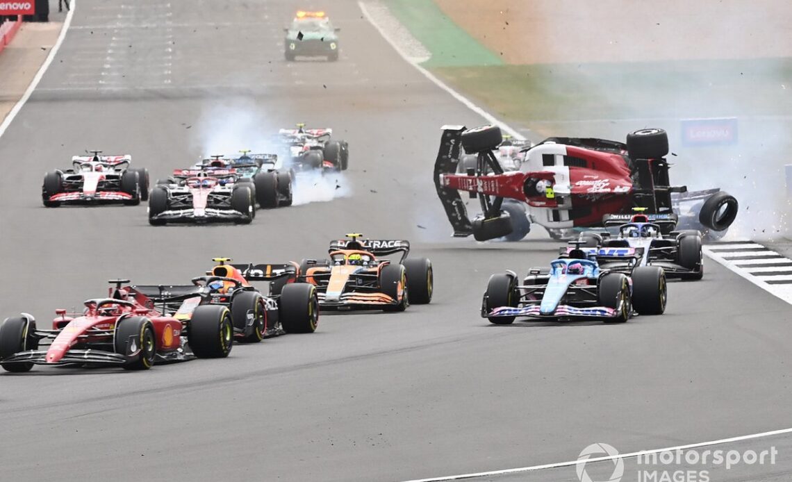 The accident involving Zhou Guanyu, Alfa Romeo C42, George Russell, Mercedes W13 at the start of the race