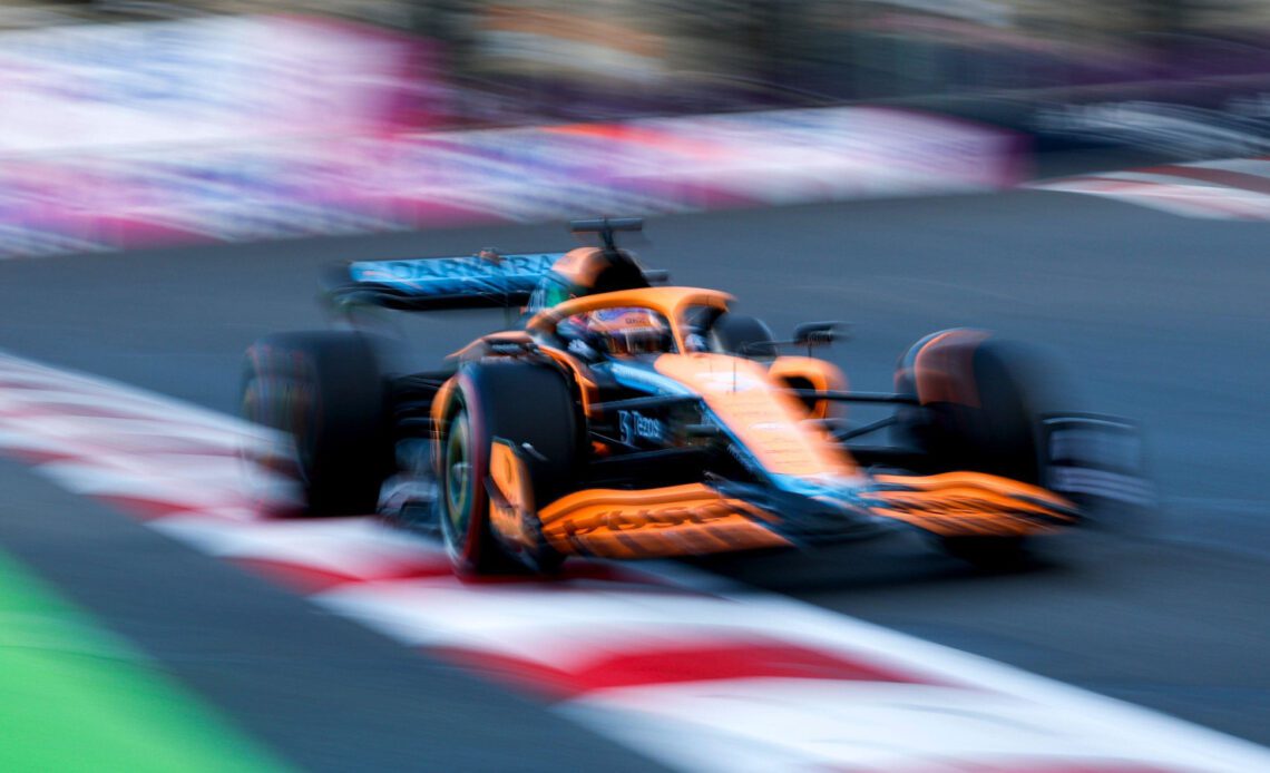 Daniel Ricciardo blurred in his McLaren. Baku June 2022
