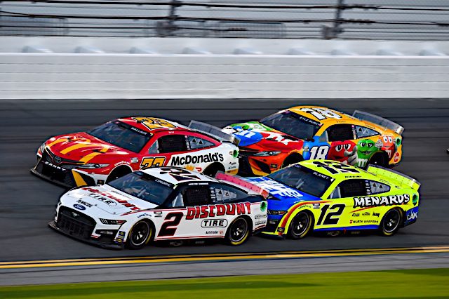 #2: Austin Cindric, Team Penske, Ford Mustang Discount Tire, #23: Bubba Wallace, 23XI Racing, Toyota Camry McDonald's, #18: Kyle Busch, Joe Gibbs Racing, Toyota Camry M&M's, #12: Ryan Blaney, Team Penske, Ford Mustang Menards/Blue DEF/PEAK
