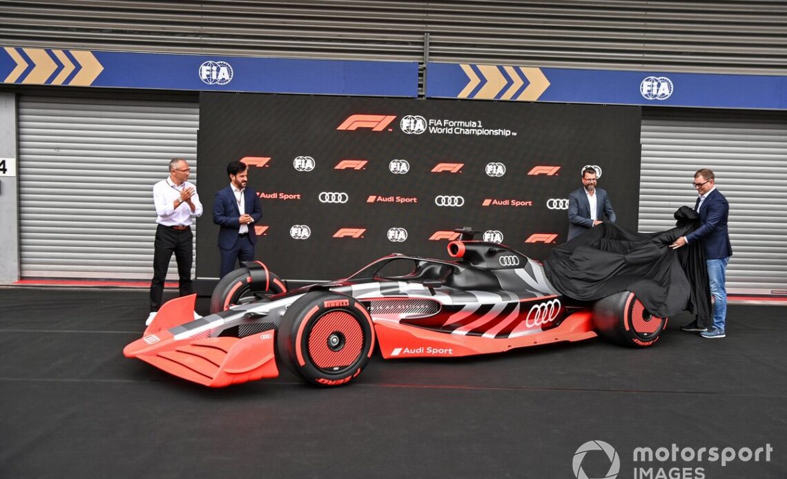 Stefano Domenicali, CEO, Formula 1, with Mohammed bin Sulayem, President, FIA, Oliver Hoffmann, Head of Technical Development at Audi Sport GmbH, Markus Duesmann, Chairman of the Board of Management of Audi AG showcase the new Audi Sport F1 concept car
