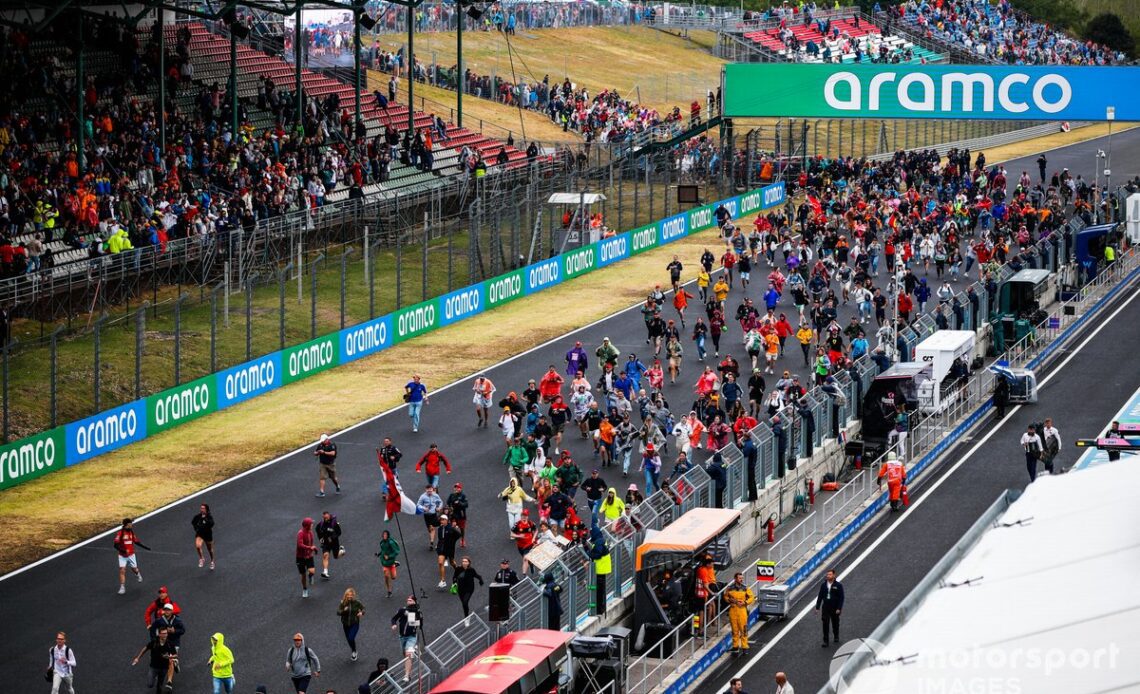 Fans invade the circuit for the podium ceremony at the end of the race
