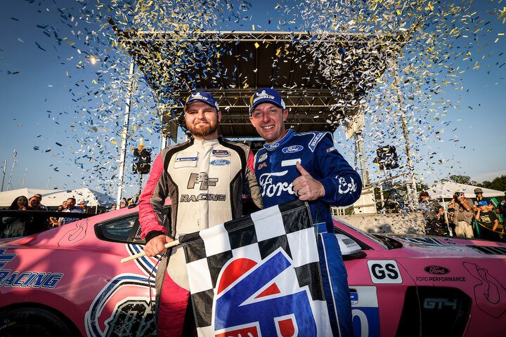 James Pesek and Joey Hand celebrate their victory in the Virginia Is For Racing Lovers Grand Prix at VIRginia International Raceway, 8/27/2022 (Photo: Courtesy of IMSA)