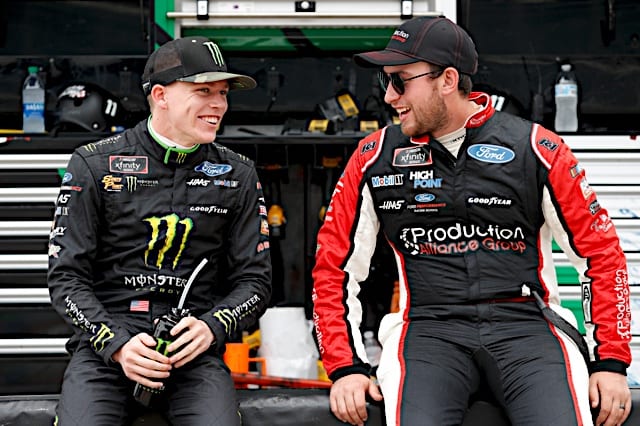 Riley Herbst and Chase Briscoe of Stewart-Haas Racing chat on pit road at Charlotte. (Photo: NKP)