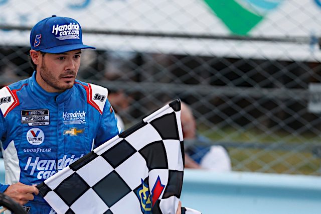 Kyle Larson of Hendrick Motorsports holds the checkered flag after winning at Watkins Glen International. (Photo: NKP)