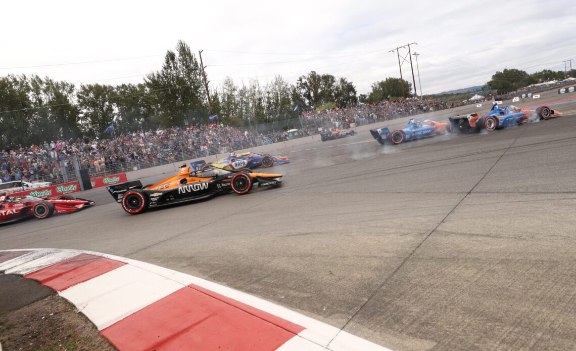 Felix Rosenqvist, Scott Dixon and Alex Palou in front of the major calamity at Portland