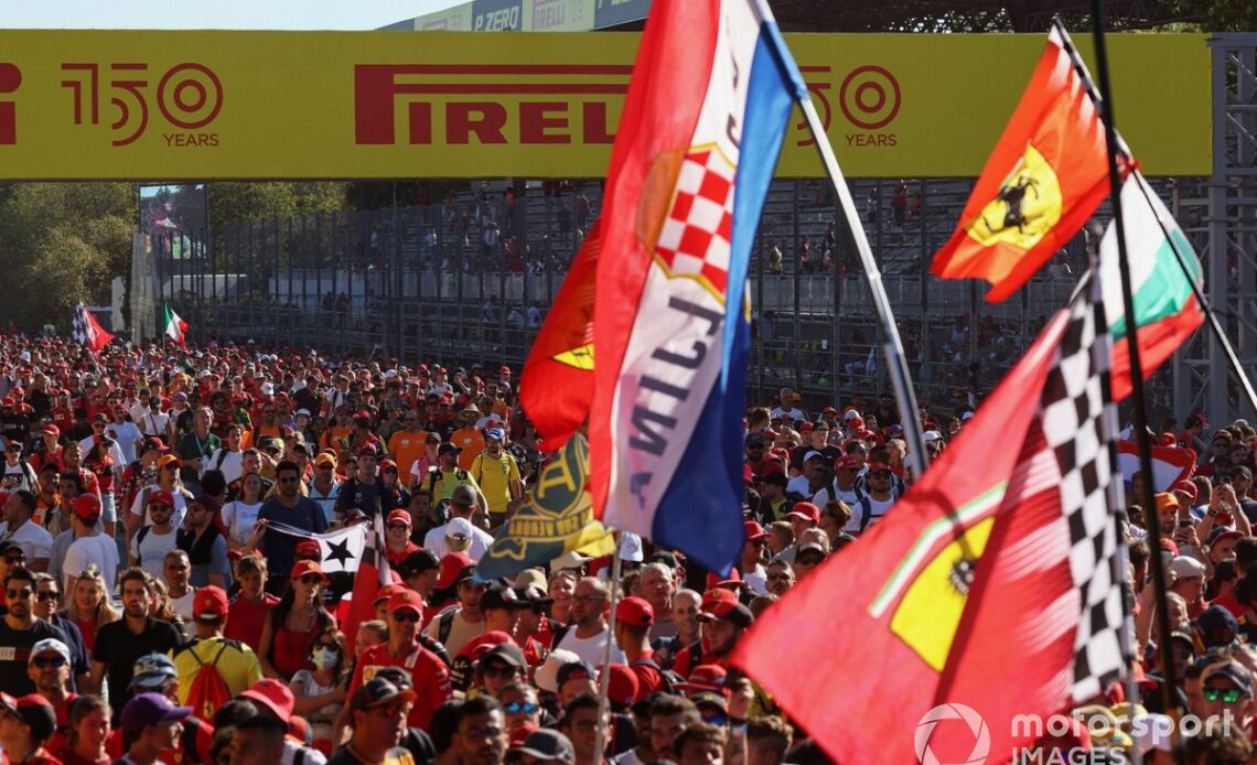 Fans flood the circuit in celebration at the end of the race