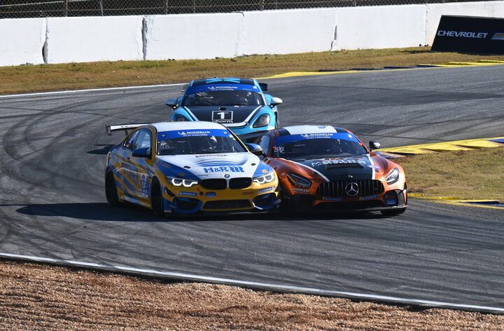 Eric Foss and Bill Auberlen come together in the chicane while fighting for the lead in the FOX Factory 120 at Michelin Raceway Road Atlanta, 11/12/2021 (Photo: Phil Allaway)