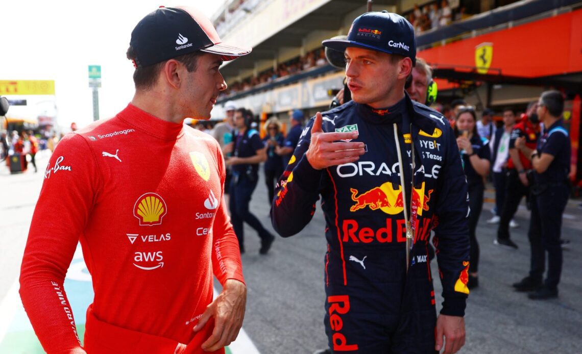 BARCELONA, SPAIN - MAY 21: Pole position qualifier Charles Leclerc of Monaco and Ferrari and Second placed qualifier Max Verstappen of the Netherlands and Oracle Red Bull Racing talk in parc ferme during qualifying ahead of the F1 Grand Prix of Spain at Circuit de Barcelona-Catalunya on May 21, 2022 in Barcelona, Spain. (Photo by Mark Thompson/Getty Images)