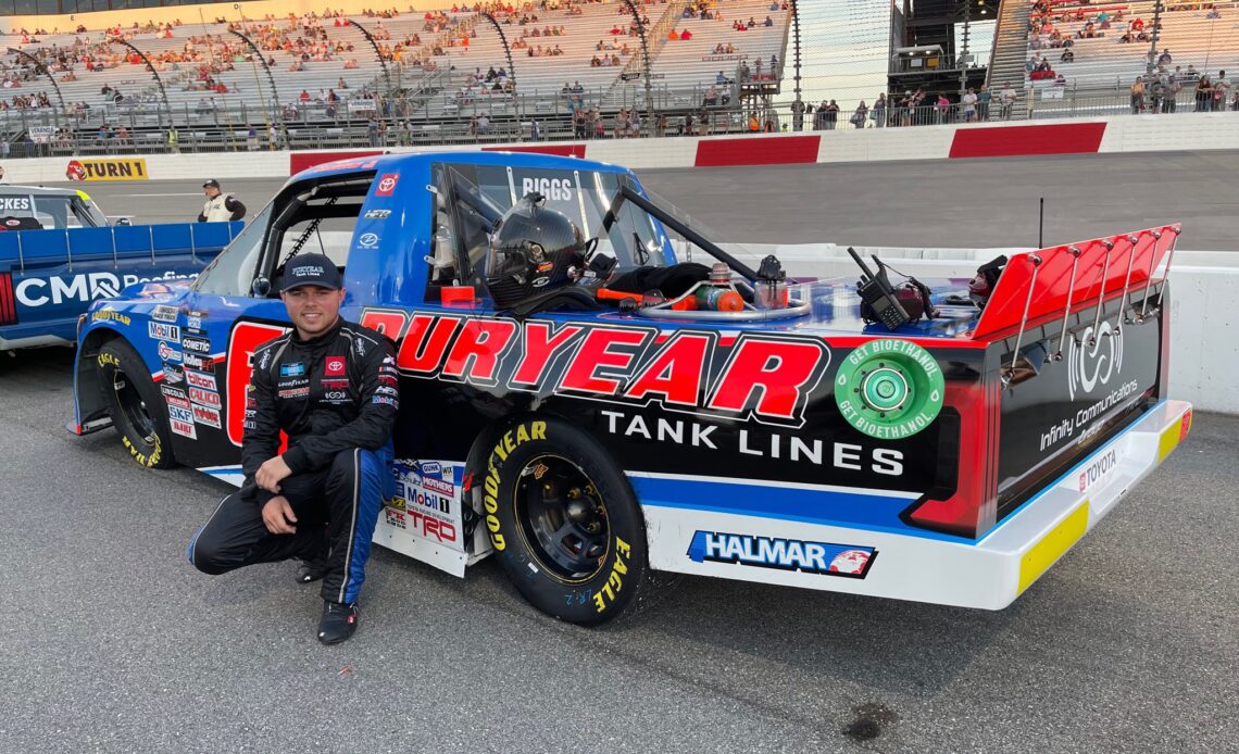Layne Riggs at Richmond Raceway in front of his truck ahead of NASCAR Truck Series race, Adam Cheek