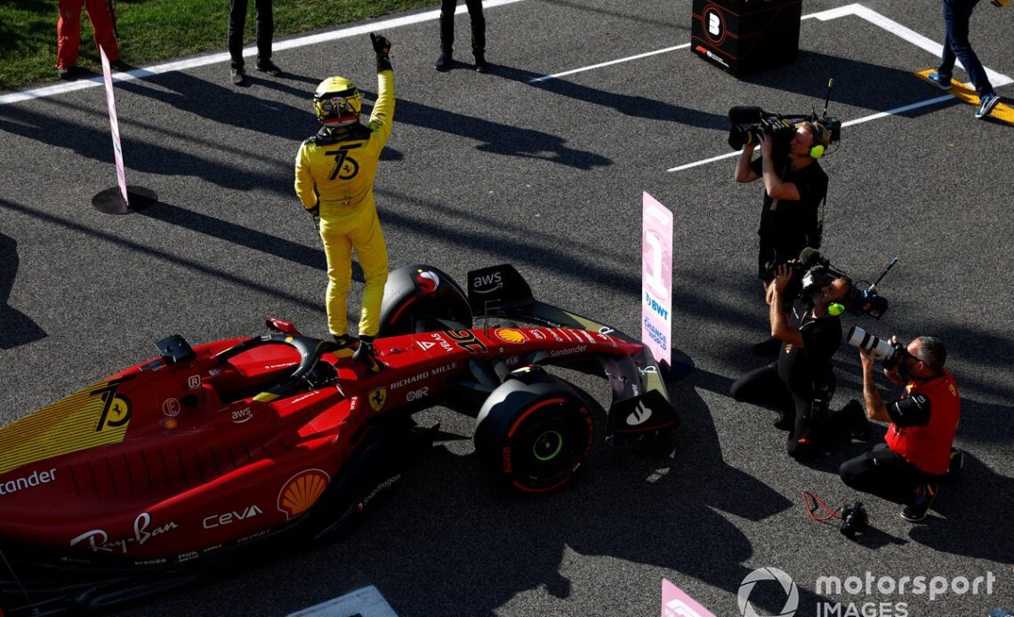 Charles Leclerc, Ferrari, celebrates on the grid after securing pole