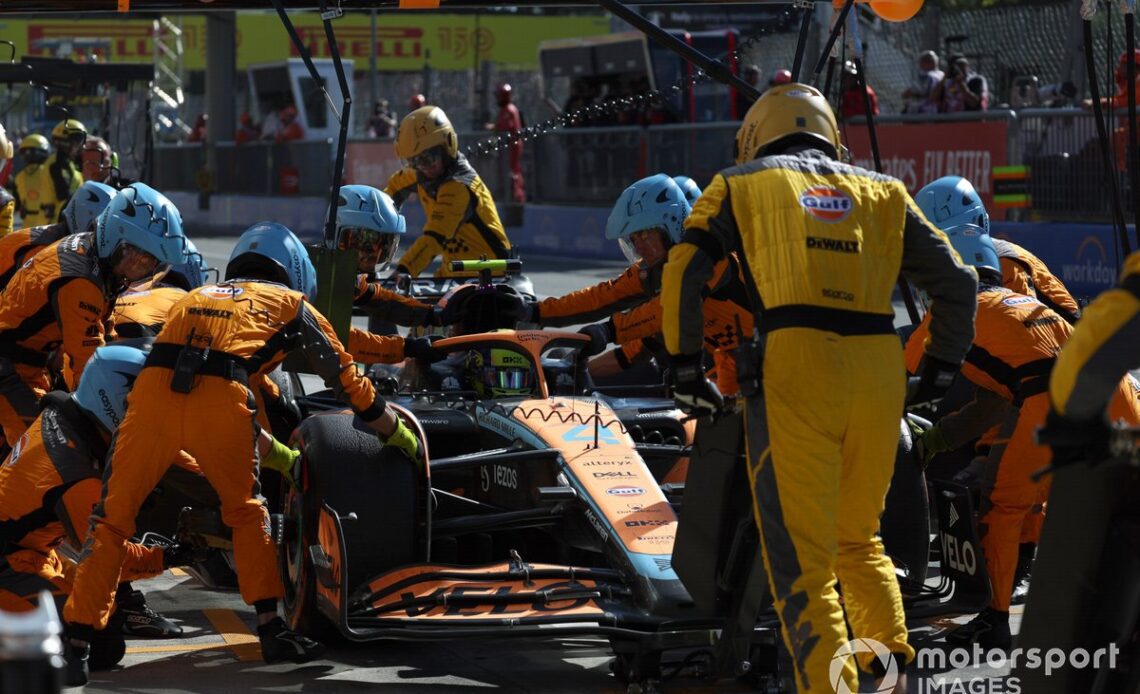 Lando Norris, McLaren MCL36, makes a pit stop