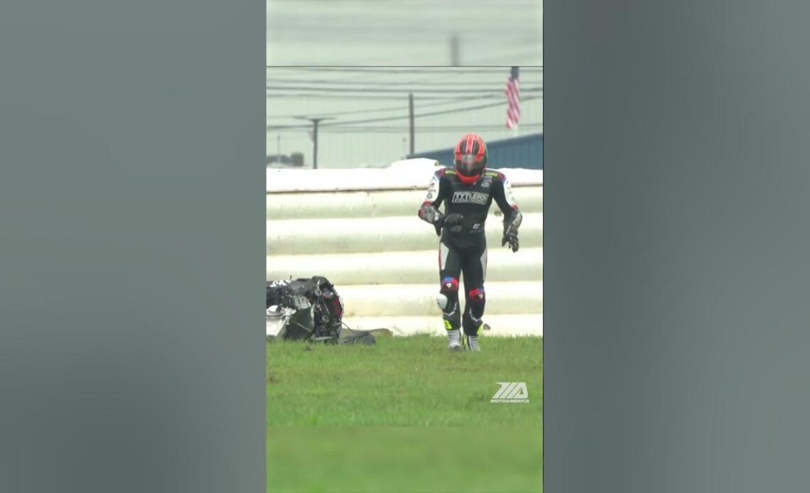 PJ Jacobsen crashes in the rain and his bike comes to a sparking halt into the air fence. #crash