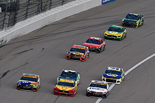 Kyle Busch, Joey Logano and Denny Hamlin lead the pack at Kansas Speedway in the 2021 Hollywood Casino 400 NASCAR Cup Series playoff race