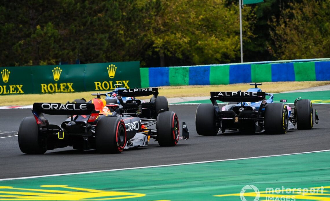 Fernando Alonso tries to keep Max Verstappen behind in Hungary.
