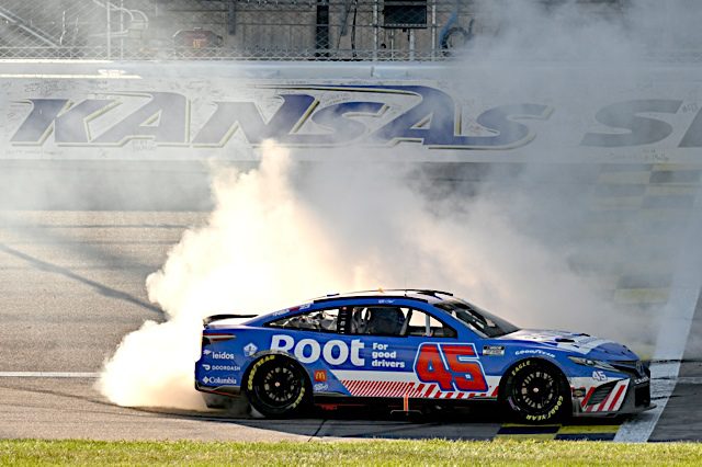 Bubba Wallace burnout after winning at Kansas in NASCAR Cup Series, Root red white and blue scheme, NKP