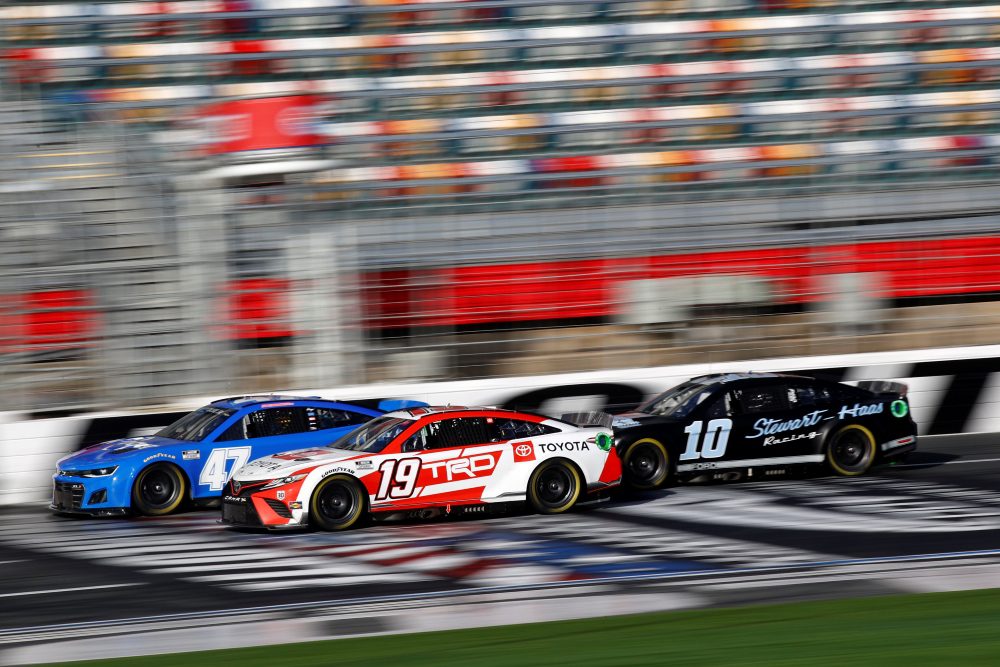 Martin Truex Jr., driver of the #19 Joe Gibbs Racing Toyota, Ricky Stenhouse Jr., driver of the #47 JTG Daugherty Racing Chevrolet, and Aric Almirola, driver of the #10 Stewart-Haas Racing Ford, drive during the NASCAR Next Gen Test at Charlotte Motor Speedway on December 17, 2021 in Concord, North Carolina. (Photo by Jared C. Tilton/Getty Images)