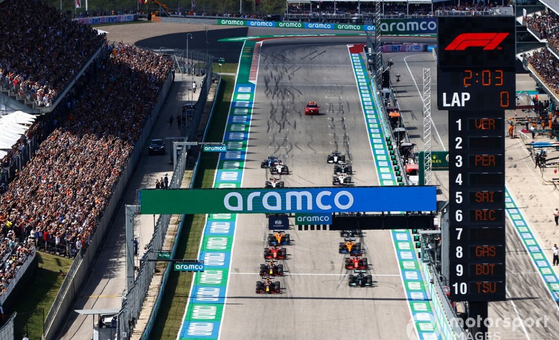 Max Verstappen, Red Bull Racing RB16B, and Lewis Hamilton, Mercedes W12, prepare to lead the field away at the start