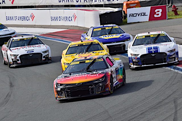 Daniel Suarez leads a pack of NASCAR Cup Series cars at Charlotte Motor Speedway, October 2022.