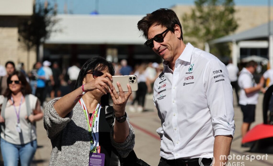 Toto Wolff, Team Principal and CEO, Mercedes AMG, has a photo taken with a fan