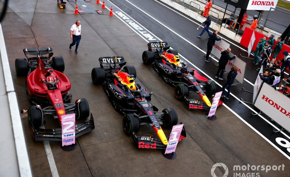 Sergio Perez, Red Bull Racing RB18, 2nd position, Charles Leclerc, Ferrari, 3rd position, in Parc Ferme