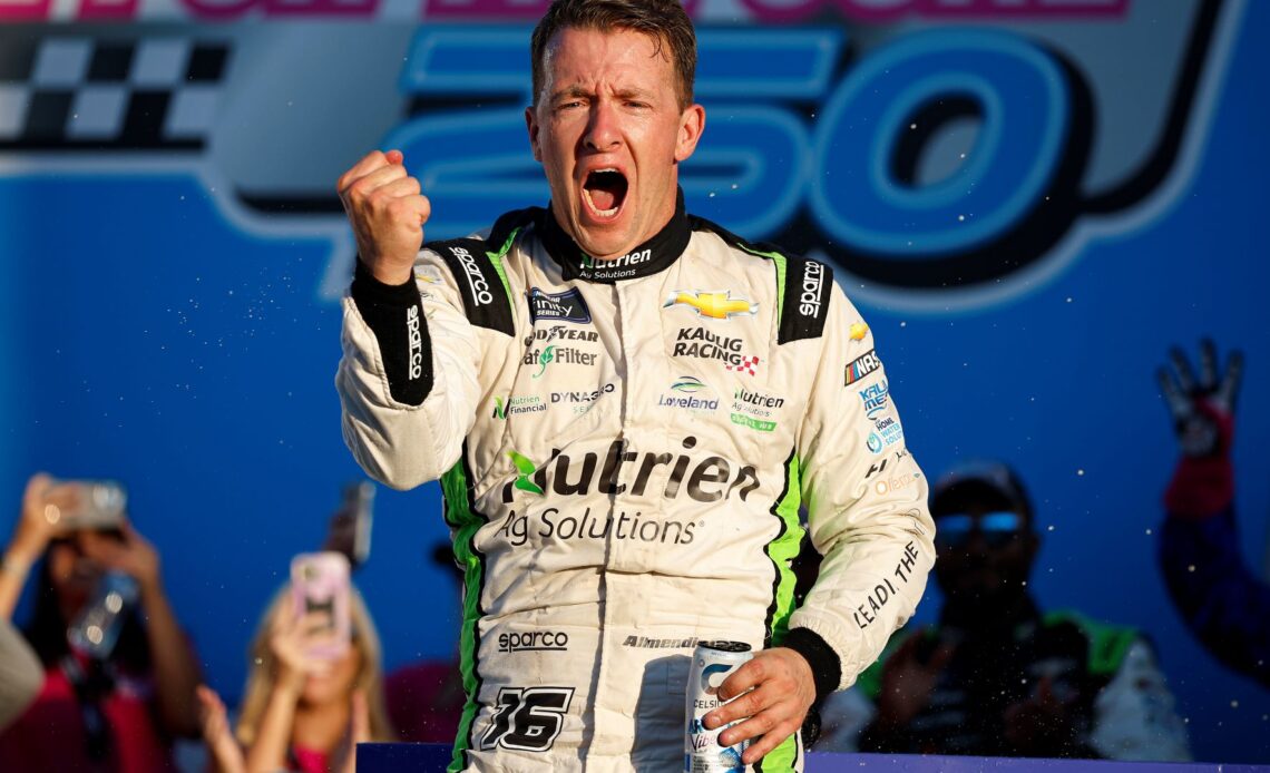 AJ Allmendinger, driver of the #16 Nutrien Ag Solutions Chevrolet, celebrates in victory lane after winning the NASCAR Xfinity Series Drive for the Cure 250 presented by BlueCross BlueShield of North Carolina at Charlotte Motor Speedway on October 08, 2022 in Concord, North Carolina. (Photo by Jared C. Tilton/Getty Images)