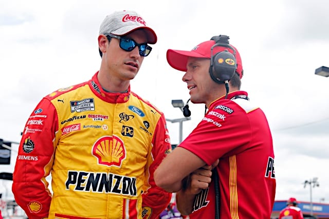 Paul Wolfe and Joey Logano chat at Charlotte Motor Speedway. (Photo: NKP)