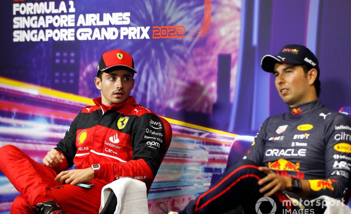 Charles Leclerc, Ferrari, 2nd position, with Sergio Perez, Red Bull Racing, 1st position, in Parc Ferme