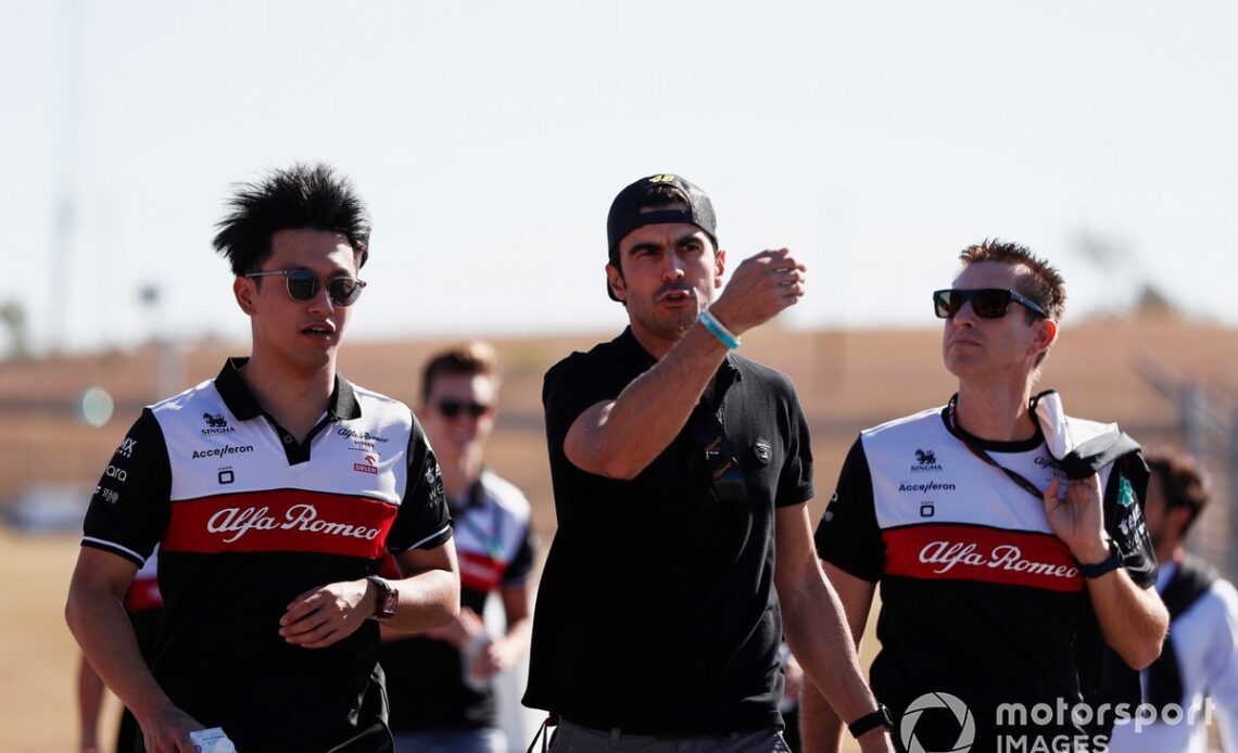 Zhou Guanyu, Alfa Romeo F1 Team, walks the track with members of his team