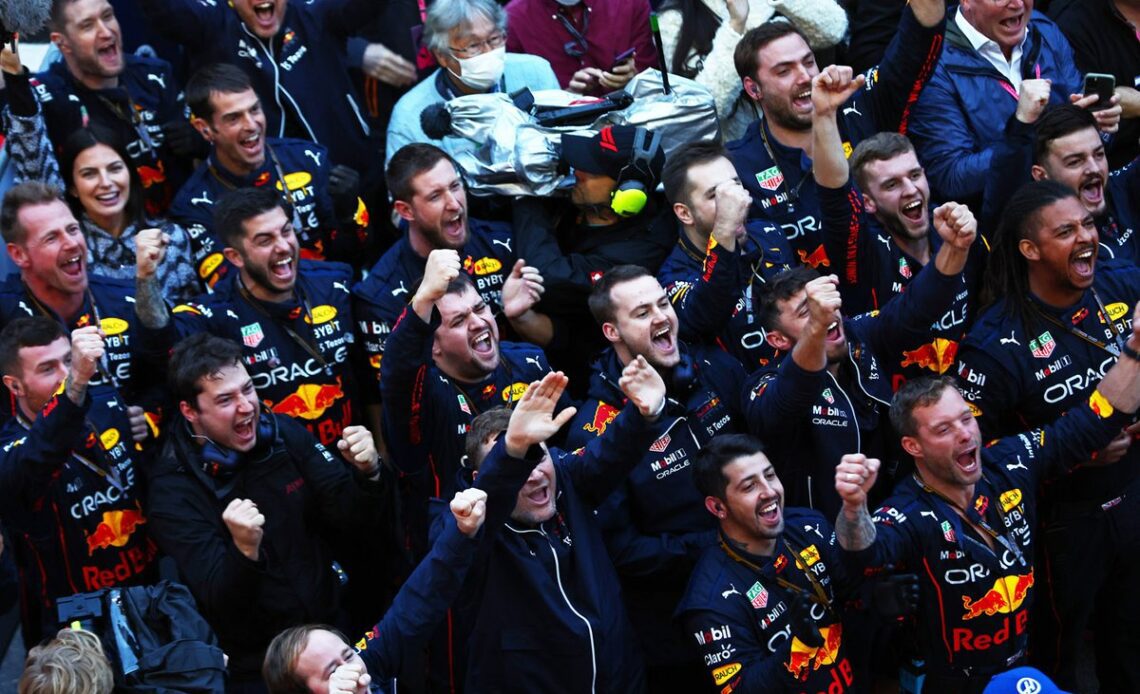 The Red Bull Racing team celebrate at the podium