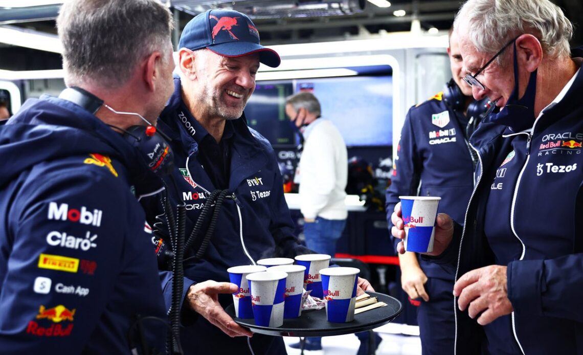 Adrian Newey, Red Bull Racing Chief Technical Officer delivers hot drinks to Red Bull Racing Team Principal Christian Horner and Red Bull Racing Team Consultant Dr Helmut Marko