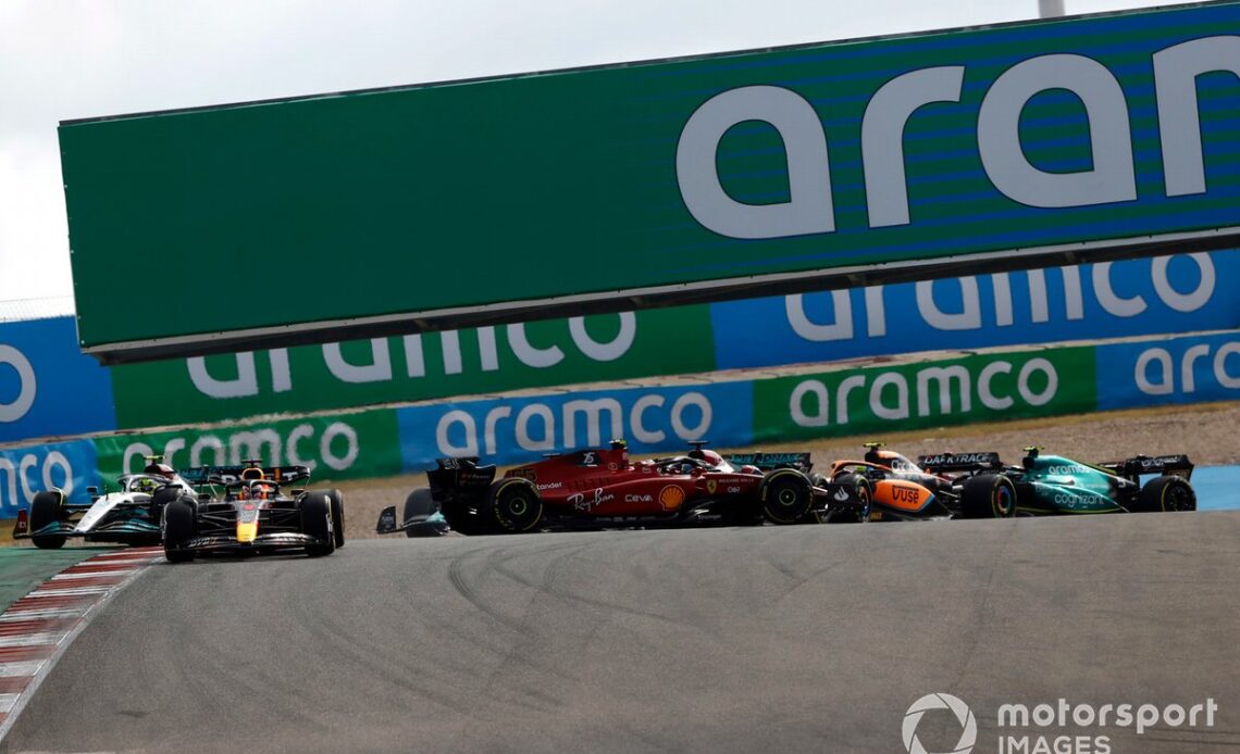 Max Verstappen, Red Bull Racing RB18, the field as Carlos Sainz, Ferrari F1-75, spins in the first corner