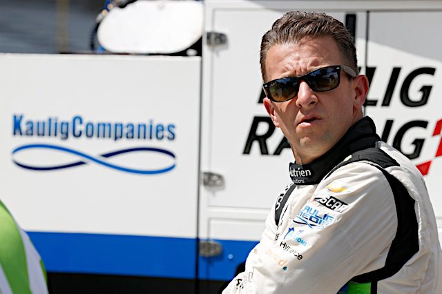 AJ Allmendinger looks up from pit road at the Indianapolis Motor Speedway road course. (Photo: NKP)
