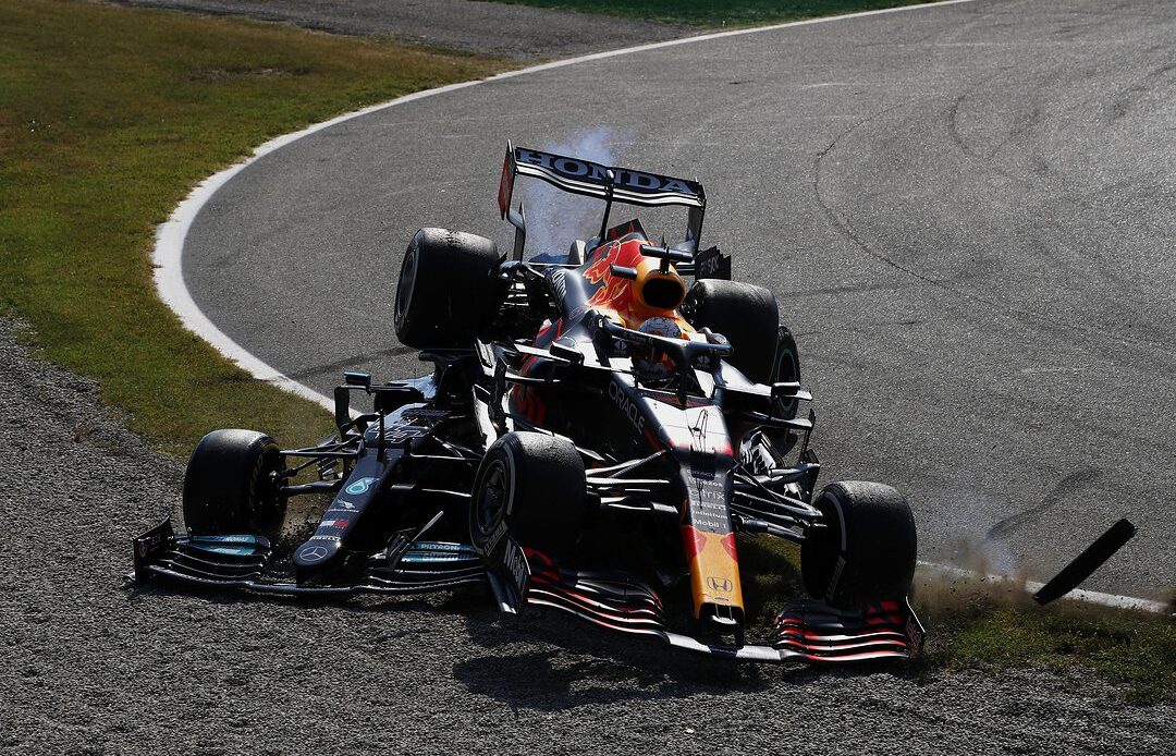 Max Verstappen climbs over the car of Lewis Hamilton in a 2021 accident at Monza. (Photo: Mercedes/AMG/Formula 1))