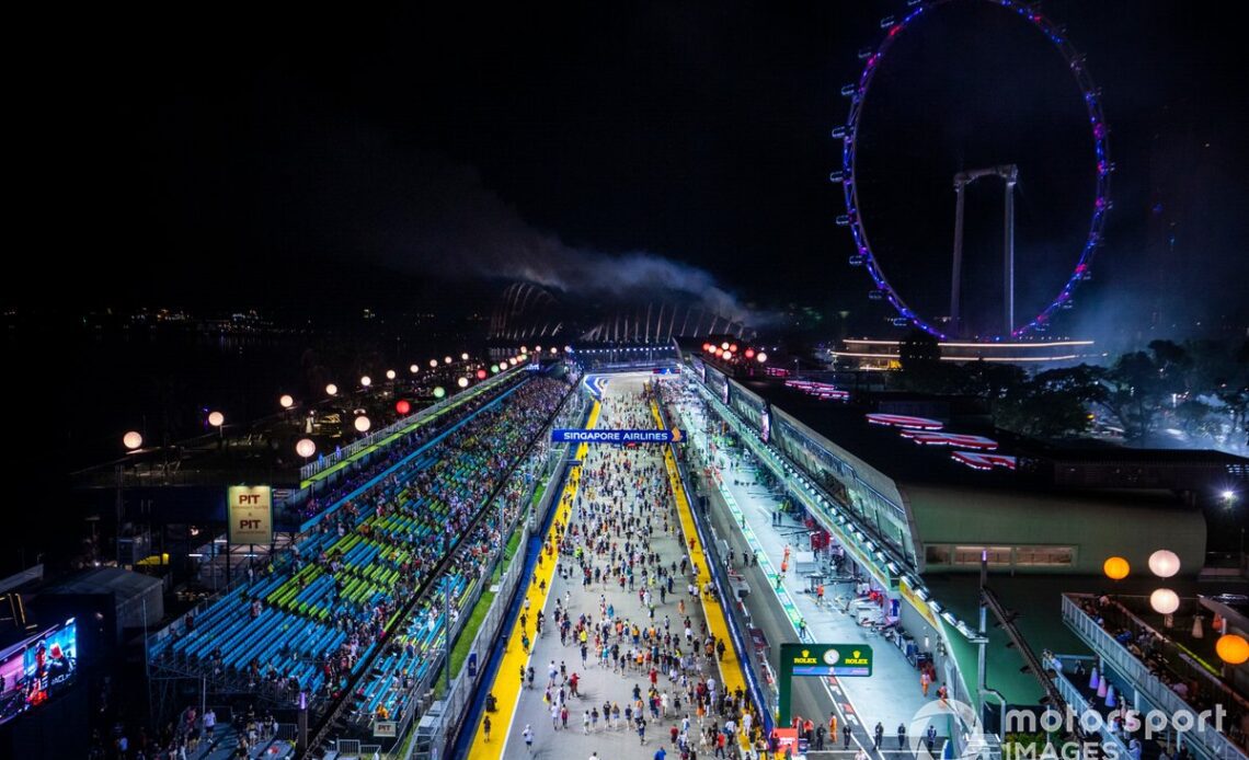 Fans flood the circuit at the end of the race