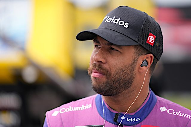 Bubba Wallace looks on from pit road during a 2022 NASCAR Cup Series race. (Photo: NKP)