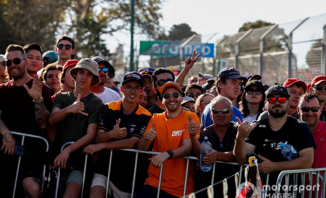 Fans behind a barrier