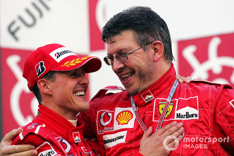 Michael Schumacher, Ferrari, and Ross Brawn, Technical Director, after his 13th win of 2004 in Japan