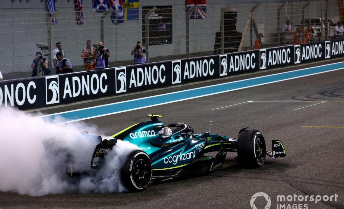 Sebastian Vettel, Aston Martin AMR22, performs donuts on the grid at the end of the race