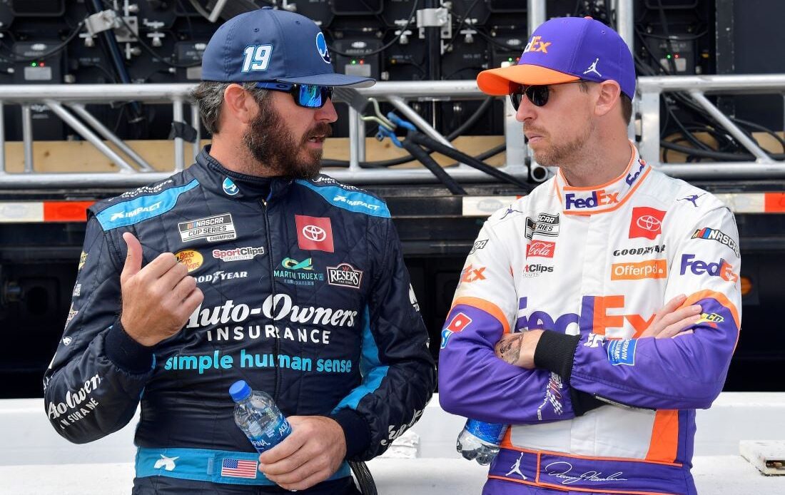 Martin Truex Jr. and Denny Hamlin talk on pit road before the 2021 Xfinity 500 at Martinsville Speedway. (Photo: Getty Images)