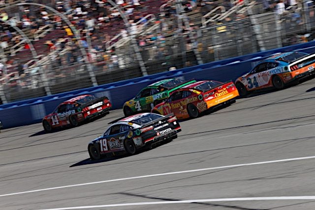 A pack of NASCAR race cars in the 2022 Wise Power 400 in Fontana, California. Photo: NKP