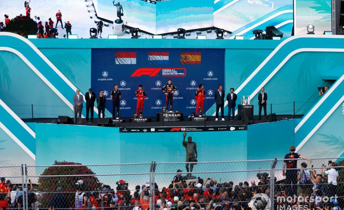 Charles Leclerc, Ferrari, 2nd position, the Red Bull Racing trophy delegate, Max Verstappen, Red Bull Racing, 1st position, Carlos Sainz, Ferrari, 3rd position, on the podium