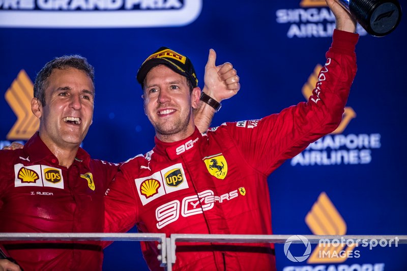 Inaki Rueda, Head of Strategy, Ferrari, and Sebastian Vettel, Ferrari, 1st position, on the podium