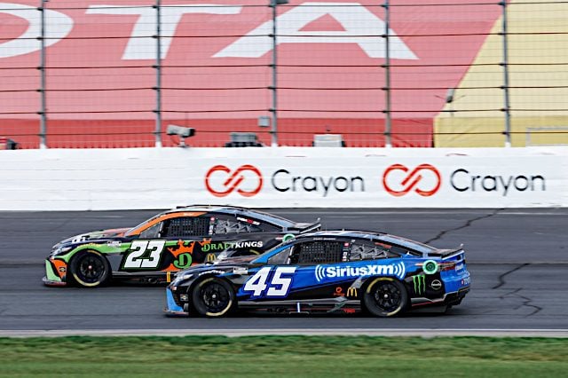 23XI Racing drivers Bubba Wallace and Kurt Busch race at New Hampshire Motor Speedway, July 2022. Photo: NKP