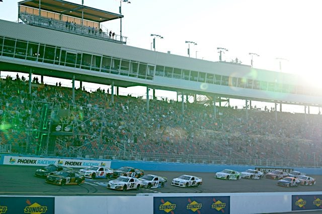 Sammy Smith pack racing, wide view of stands at Phoenix Raceway, NKP