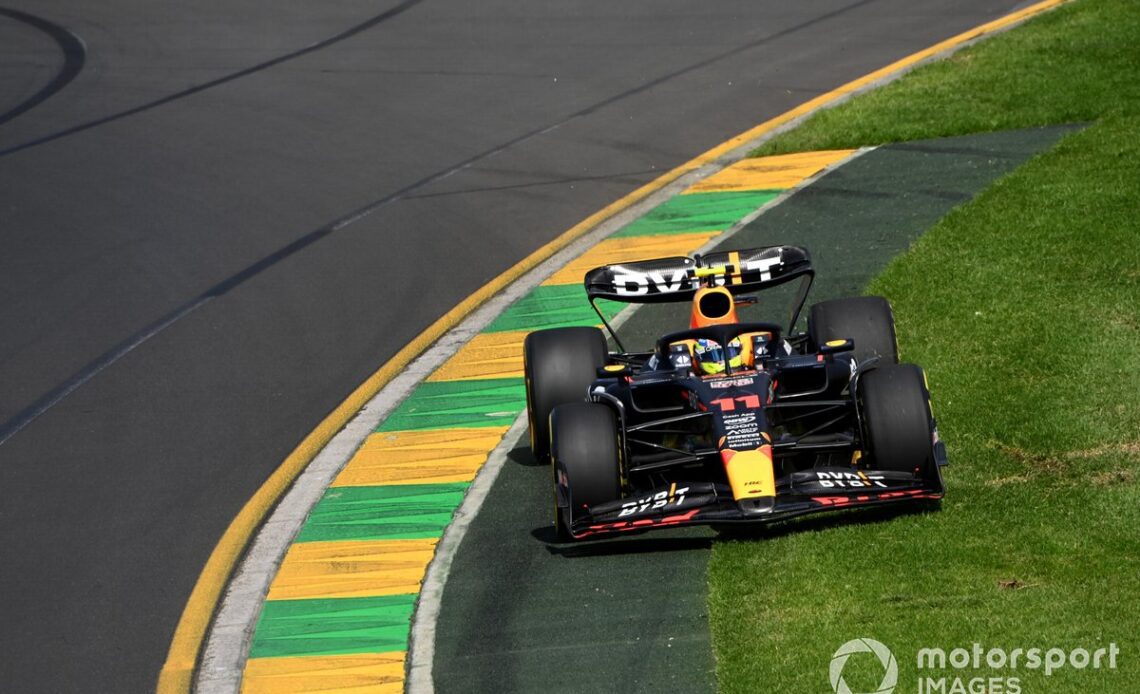 Sergio Perez, Red Bull Racing RB19, cuts onto the grass