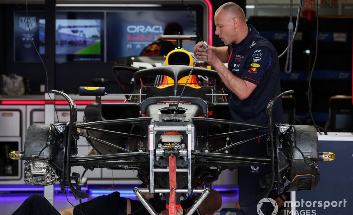 A mechanic works on the car of Max Verstappen, Red Bull Racing RB19