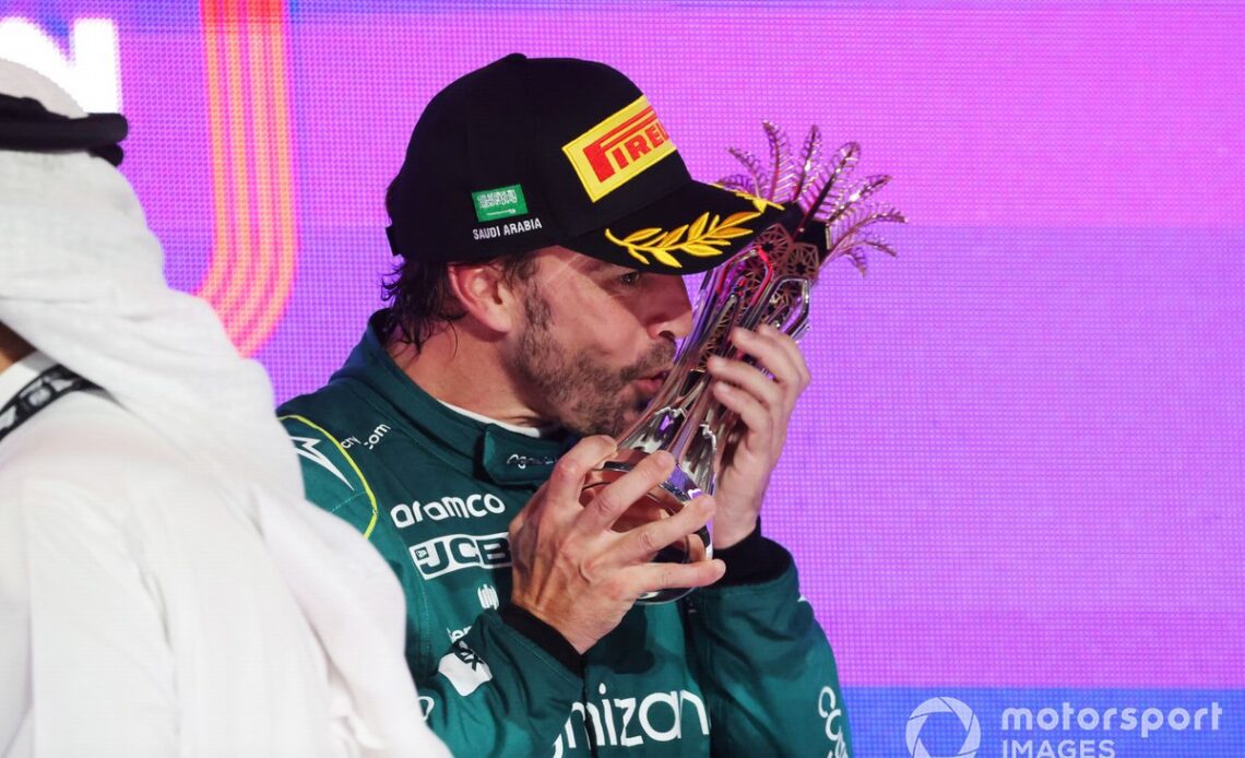 Fernando Alonso, Aston Martin F1 Team, provisionally 3rd position, receives the trophy