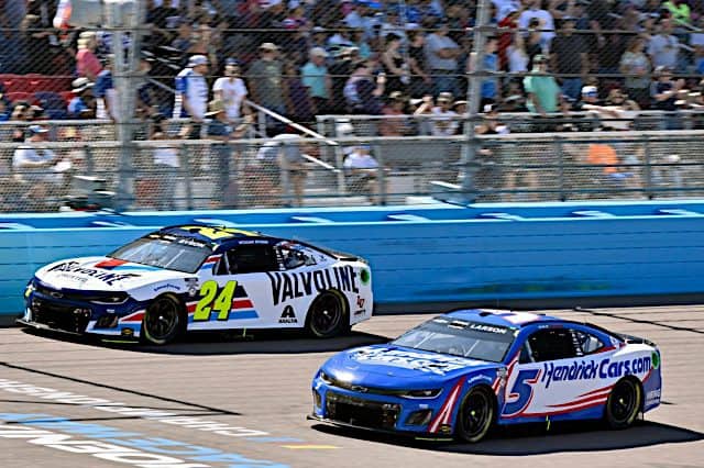 2023 Cup Phoenix I side-by-side racing Hendrick Motorsports teammates William Byron, No. 24 Chevrolet, and Kyle Larson, No. 5 Chevrolet (Credit: NKP)