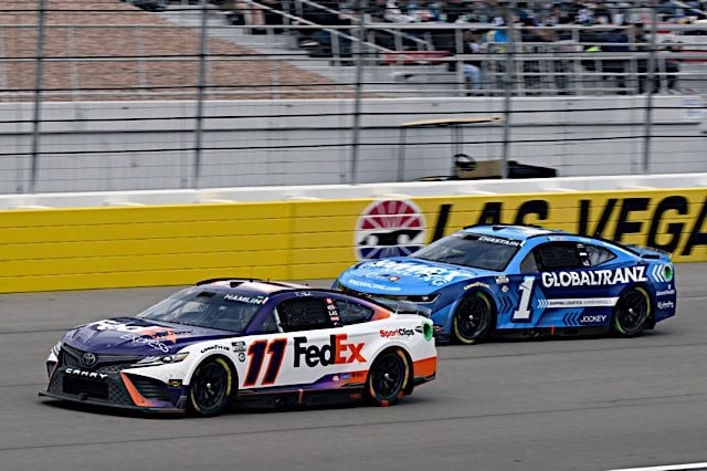 Denny Hamlin's No. 11 FedEx Toyota of Joe Gibbs Racing and Ross Chastain's No. 1 of Trackhouse Racing Team compete at Las Vegas Motor Speedway, NKP