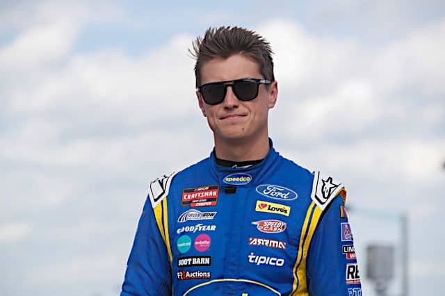 NASCAR Camping World Truck Series, Zane Smith wearing sunglasses and a blue firesuit, NKP